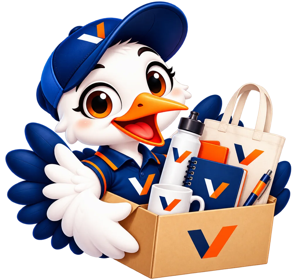 Mascota de VANYS con una caja de merchandising personalizado: tomatodo, taza, libreta, lapicero y bolsa con logo